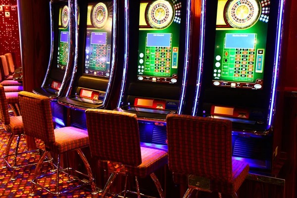 Live dealer at Monopoly Live studio with spinning wheel and game board